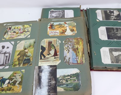 Lot 423 - An early 20th century postcard album, the red...