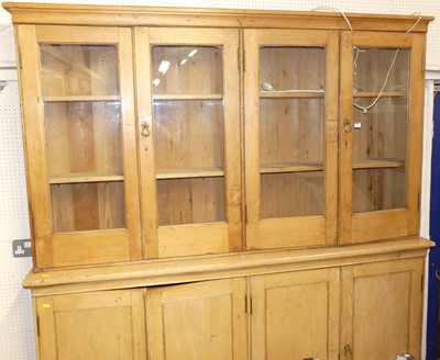 Lot 1104 - A Victorian pine bookcase cupboard, the four...