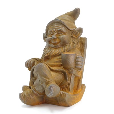 Lot 441 - A rusted metal model of a garden gnome seated...