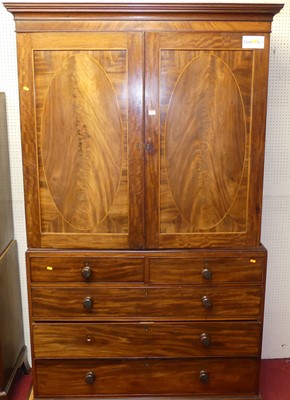 Lot 1105 - A Regency mahogany linen press, the twin...