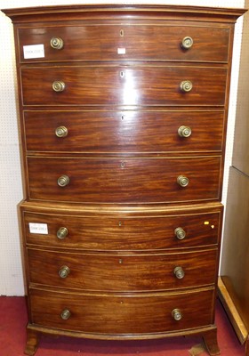 Lot 1106 - A Regency mahogany bowfront chest on chest,...