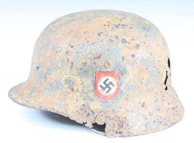 Lot 3356 - A German M35 steel helmet, in relic condition,...