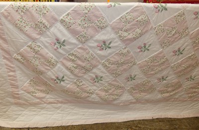 Lot 1114 - A pink, white, and floral decorated eiderdown