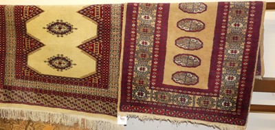 Lot 1121 - A Persian woollen beige and red ground Bokhara...