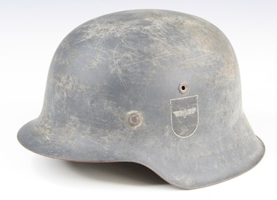 Lot 3359 - A German M42 steel helmet in grey with...