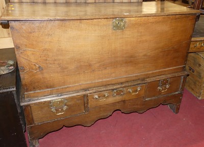 Lot 1195 - An 18th century elm hinge topped mule chest,...