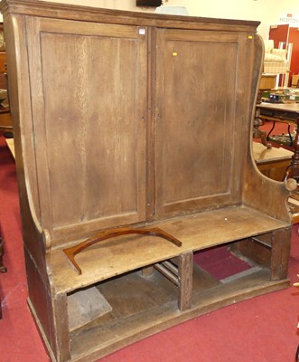 Lot 1220 - A 19th century provincial oak curved settle,...