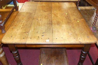 Lot 1224 - A Victorian stained pine plank topped round...