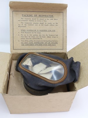 Lot 472 - A vintage respirator gas mask, boxed