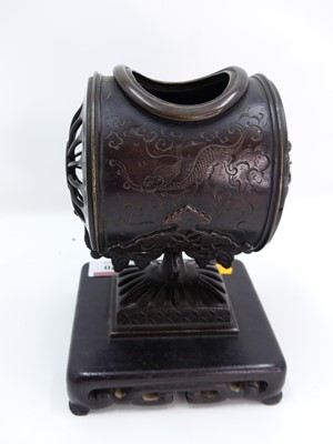 Lot 470 - A Chinese bronzed metal and carved hardwood...