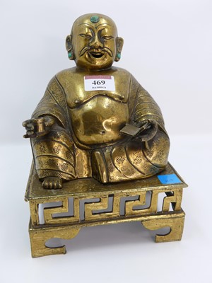 Lot 469 - A Chinese gilt brass figure of the buddha,...