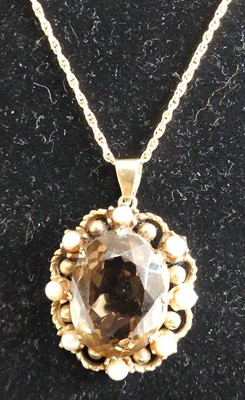 Lot 287 - A modern oval cut smoky quartz and seed pearl...