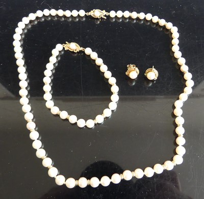 Lot 297 - A cultured pearl knotted necklace, having...