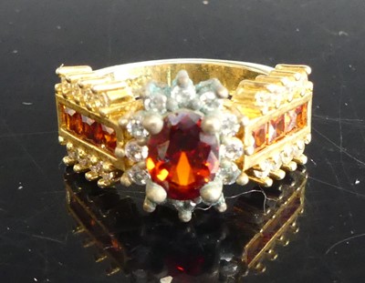 Lot 300 - A gilt metal and paste set dress ring, size M