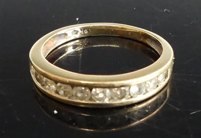 Lot 301 - A 9ct gold diamond set half eternity ring,...