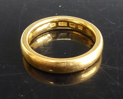 Lot 311 - A 22ct gold court shaped wedding band, sponsor...