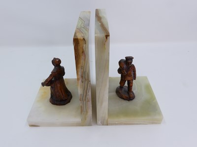 Lot 105 - A pair of onyx and metal figural bookends, h.18cm