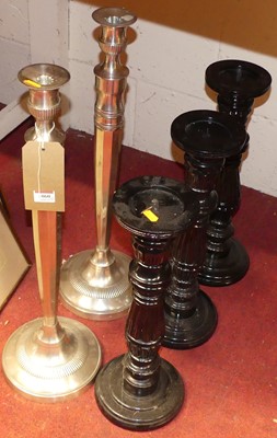 Lot 1060 - A pair of polished metal candlesticks, h.64cm;...