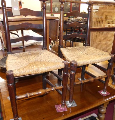 Lot 1228 - A pair of 19th century elm ladderback rush...