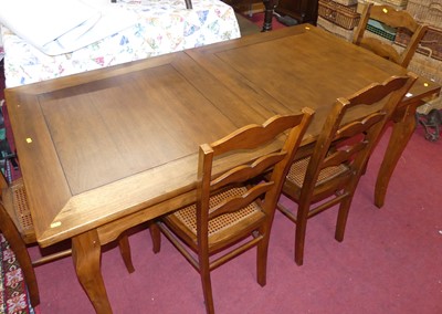 Lot 1237 - A contemporary French cherry wood dining suite,...