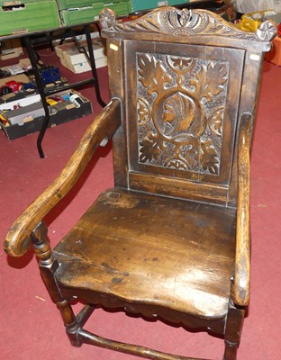 Lot 1258 - A joined oak panelled seat Wainscot chair,...