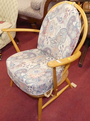 Lot 1265 - An Ercol blond elm stick back elbow chair,...