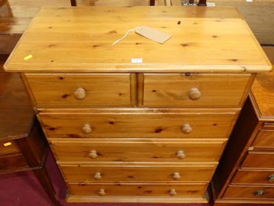 Lot 1285 - A modern pine chest of two short over four...