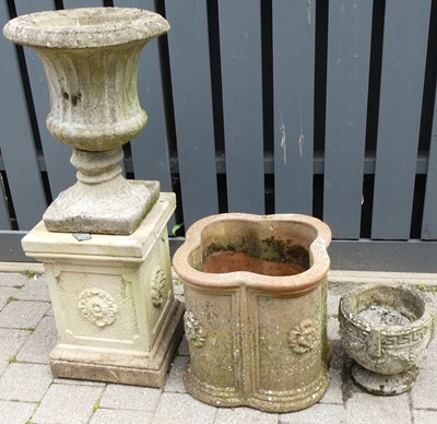 Lot 1314 - A reconstituted stone garden footed planter...