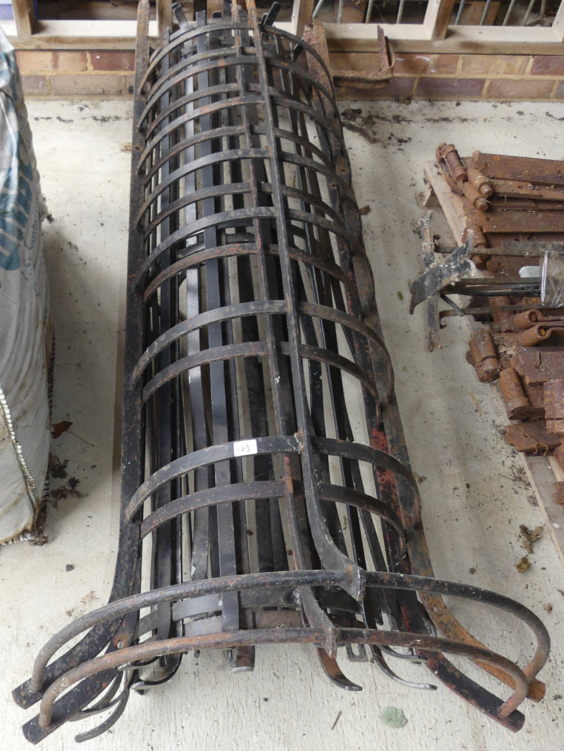 Lot 81 - A pair of wrought iron tree guards, gross...