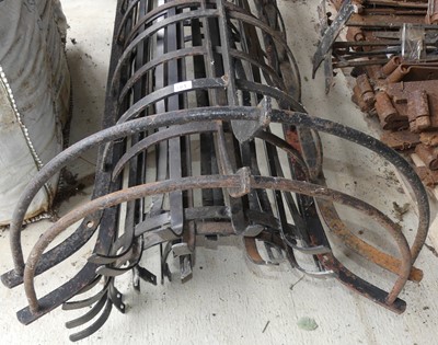Lot 81 - A pair of wrought iron tree guards, gross...