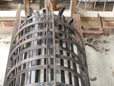 Lot 81 - A pair of wrought iron tree guards, gross...