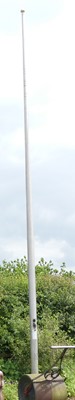 Lot 107 - A large galvanised metal flag pole, with...