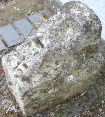 Lot 108 - A carved sandstone keystone, weathered and...