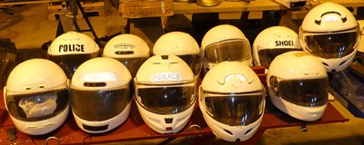 Lot 154 - A collection of motorcycle helmets,...