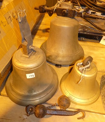 Lot 158 - A large brass bell, on iron fitting; together...