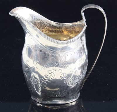 Lot 273 - A George III silver cream jug, of helmet shape...