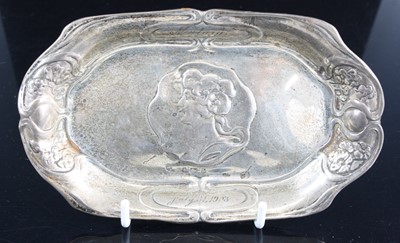 Lot 276 - An Art Nouveau silver pin tray, of shaped oval...