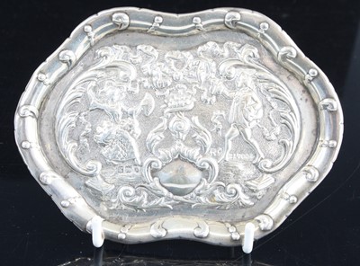 Lot 270 - An Edwardian silver pin tray, of shaped oval...