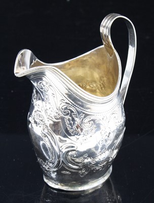 Lot 265 - A George III silver cream jug, of helmet shape...