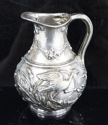 Lot 266 - A Victorian silver jug, of squat baluster form,...