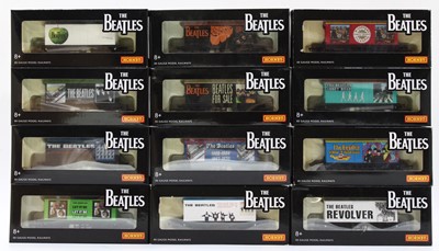 Lot 328 - Twelve Hornby ‘The Beatles’ goods wagons,...