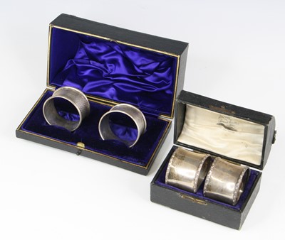 Lot 319 - A pair of George VI silver napkin rings, each...