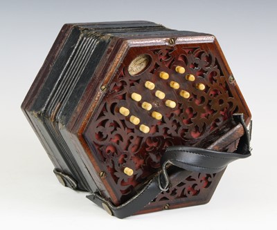 Lot 683 - A late Victorian concertina, of typical...