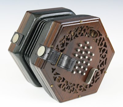 Lot 684 - A late 19th century concertina, of typical...