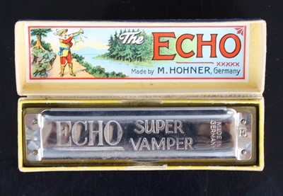 Lot 650 - An M. Hohner The Echo Super Vamper harmonica,...