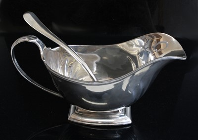 Lot 122 - An Art Deco silver pedestal sauceboat, the...