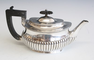 Lot 2229 - A Victorian silver teapot, of half-reeded oval...