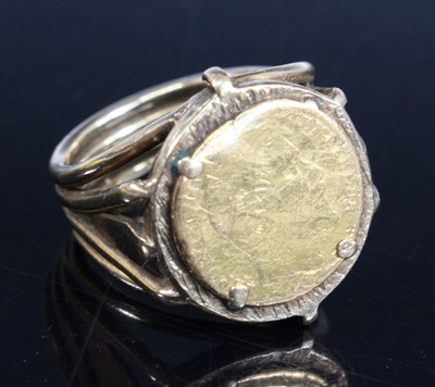 Lot 402 - A yellow metal coin ring, featuring a 14mm...