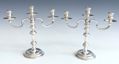 Lot 145 - A pair of 1960s silver three-sconce table...