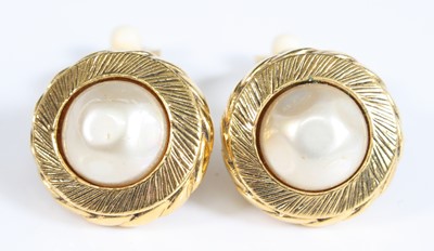 Lot 416 - A pair of gold plated Chanel clip earrings,...